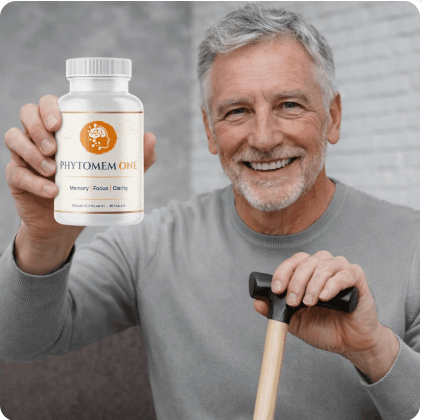 Older man holding a bottle of Phytomem One supplement